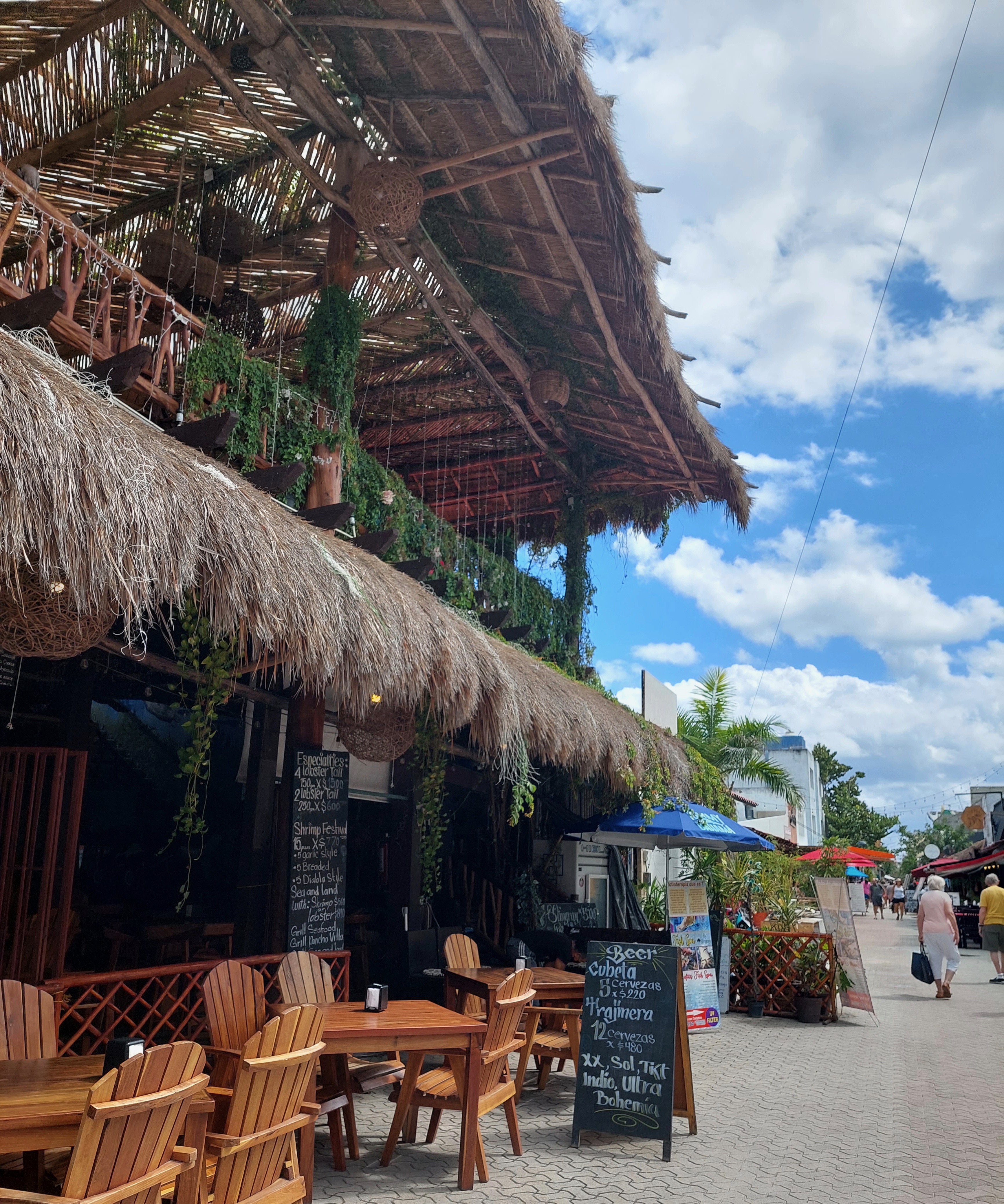restaurant on the streets of centro Isla Mujeres alongside clear blue skies in the background