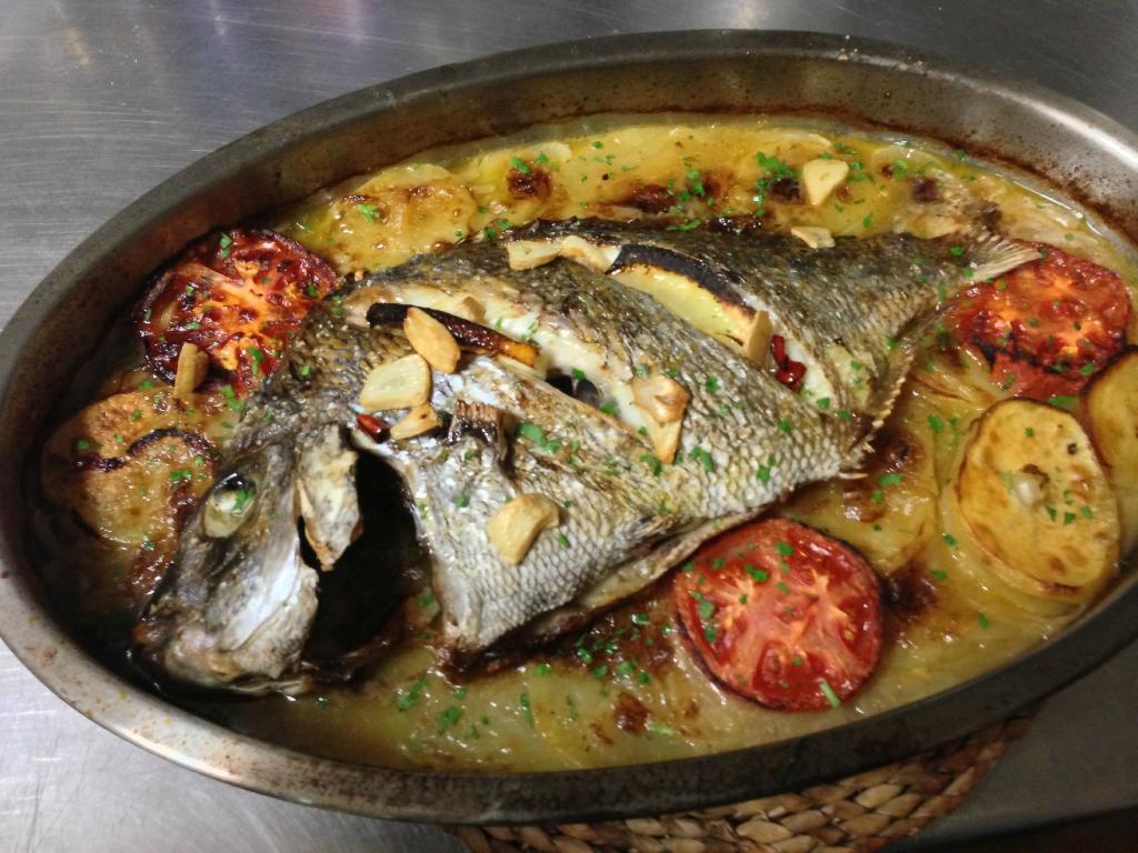 spanish seafood dish of fish served on a pan 