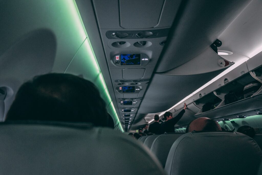 passengers sitting on plane in the night getting ready for takeoff