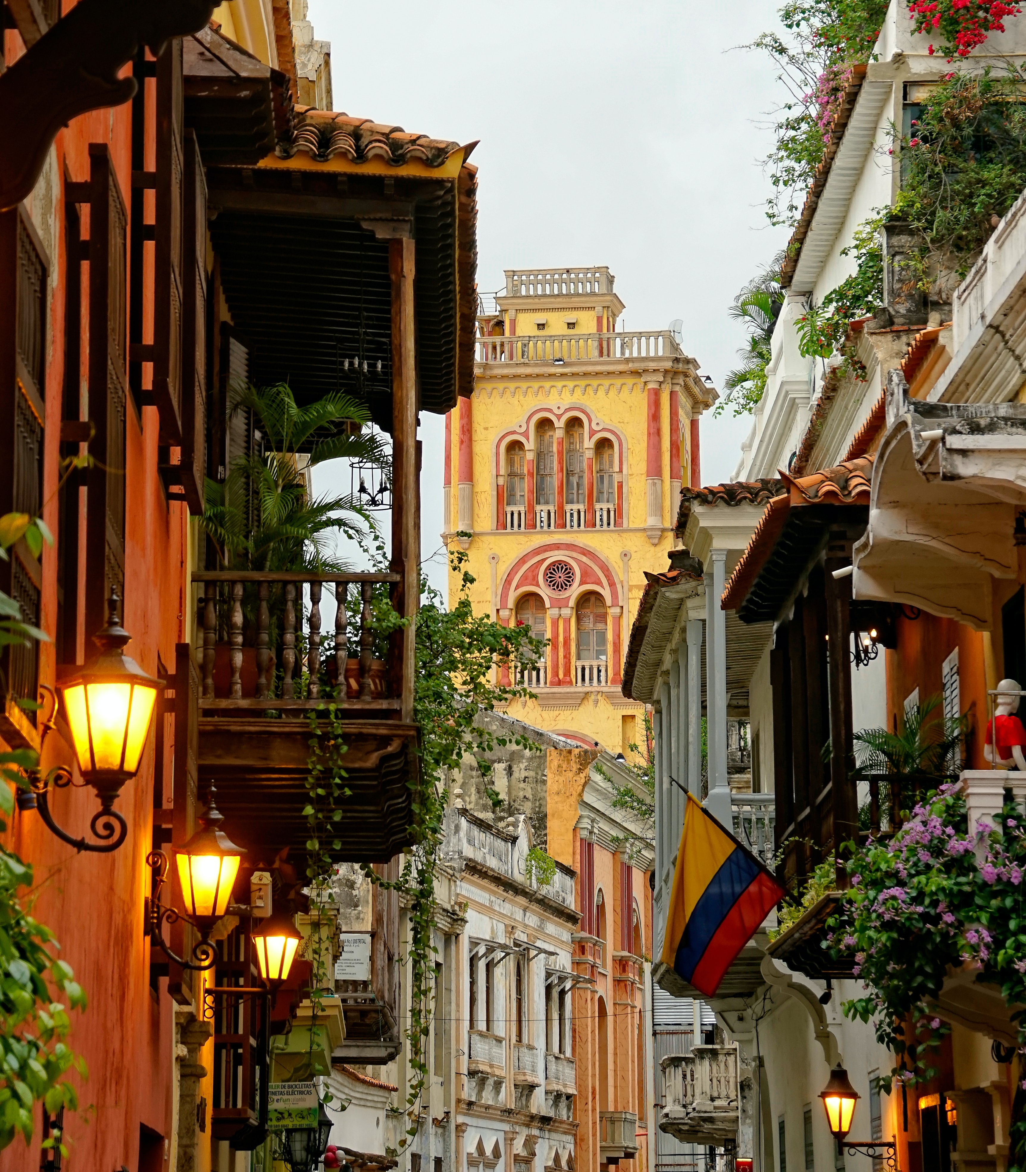 colourful buildings ahead being shown with a dimming sky in the evening through the streets of cartagena colombia