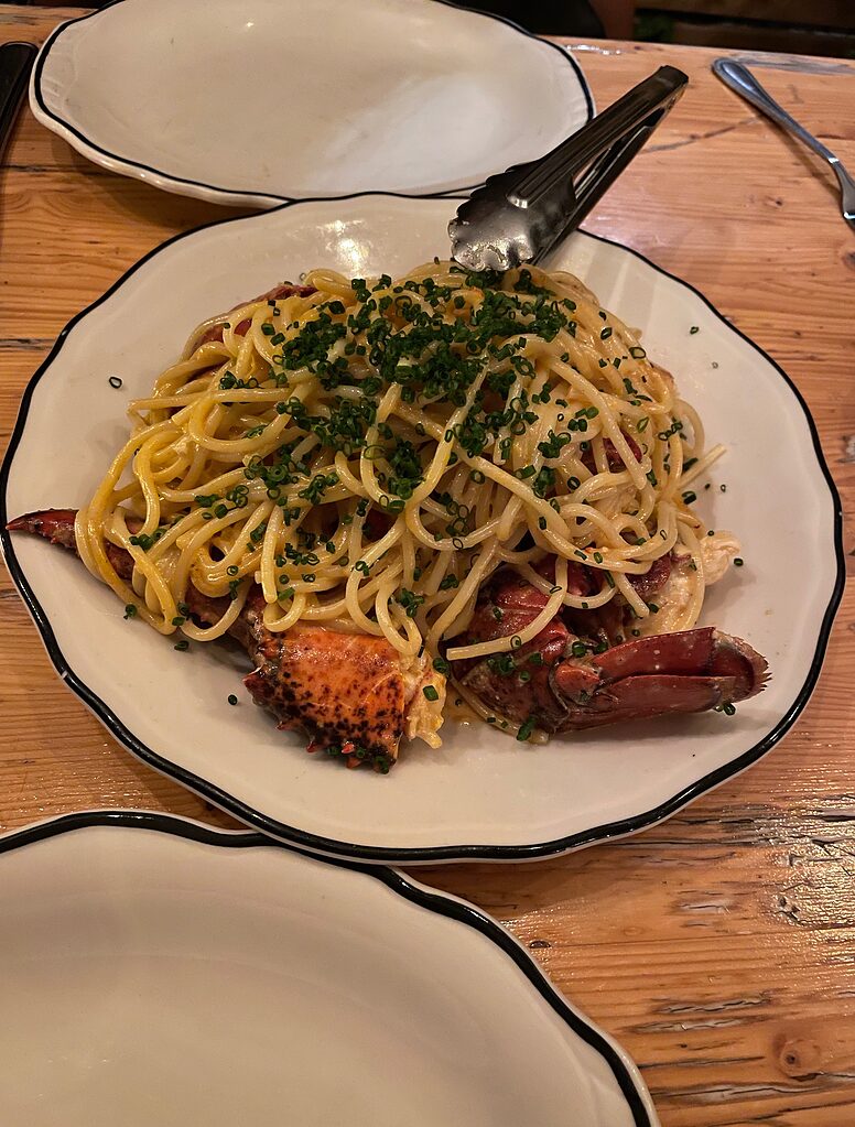 a plate full of lobster pasta at restaurant Joe Beef Montreal
