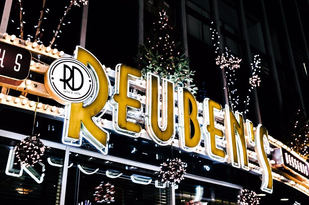 Lit sign outside at Reubens Deli and Steakhouse in Montreal, Canada