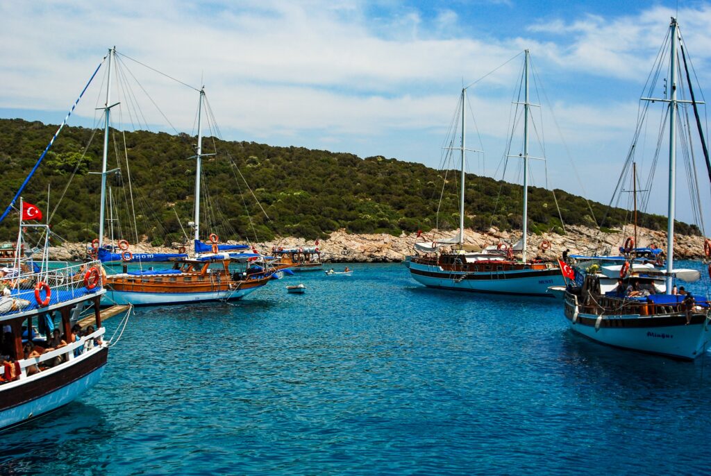 sail boats sailing in crystal clear waters in bodrum turkey