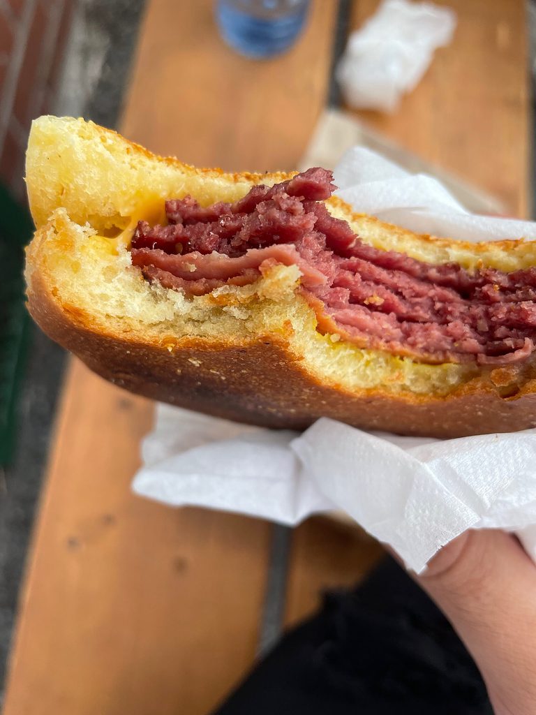 Beef bologna with cheddar cheese on a soft toasted white bread, known as Wilenskys famous sandwich named "the special"