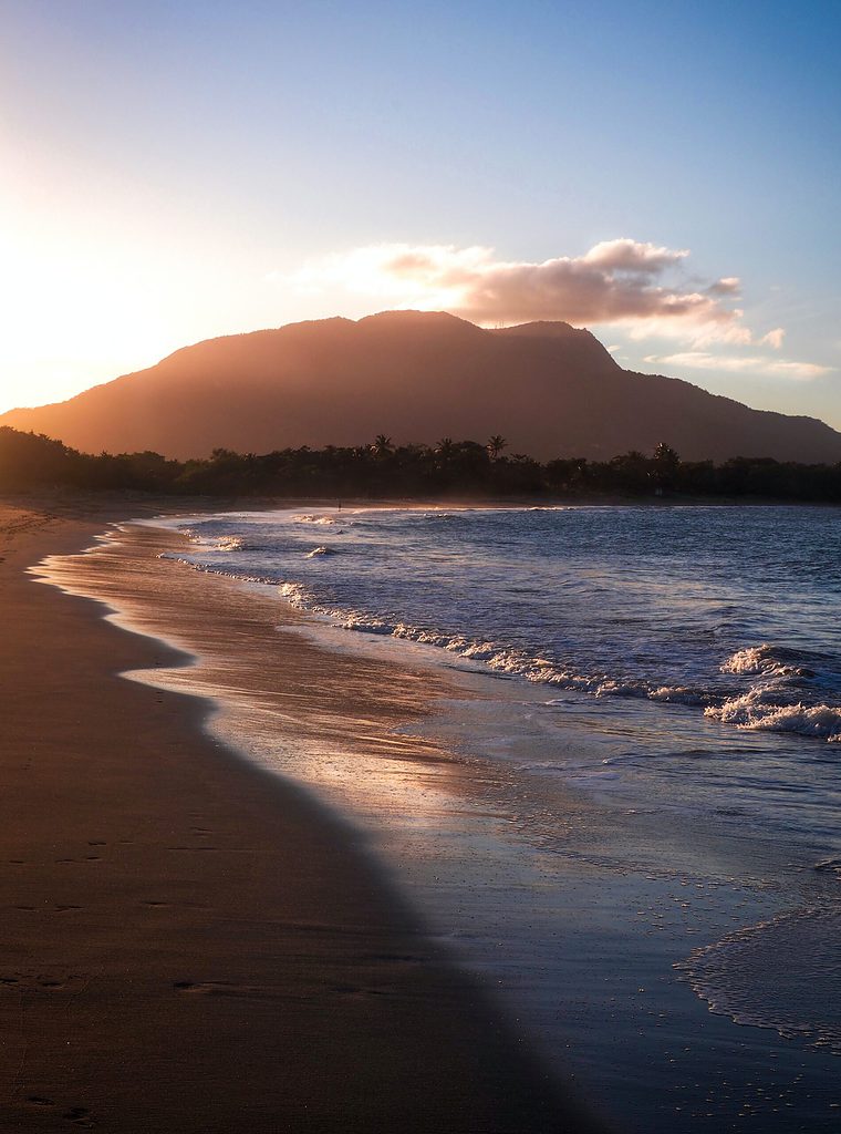 sunset in the evening with a quiet, empty beach shoreline in Puerto Plata Dominican republic  