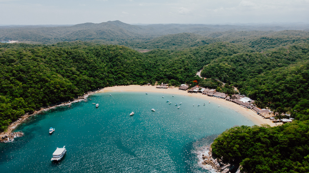 beach shoreline at the hidden beach named Bahia Maguey in Huatulco, Mexico