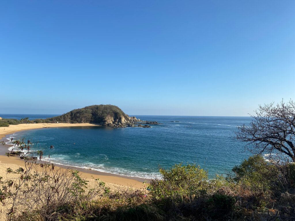 stunning beach shoreline with clear skies in Santa Maria Huatulco