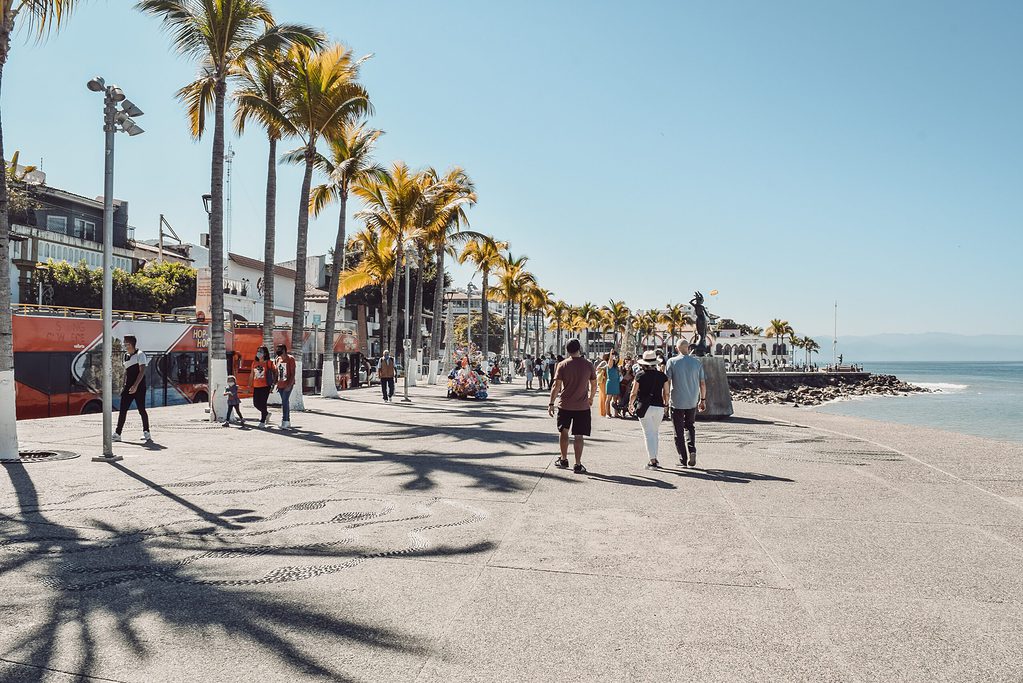 many tourists walking on the main boardwalk also known as Malcon in Puerto Vallarta, Mexico