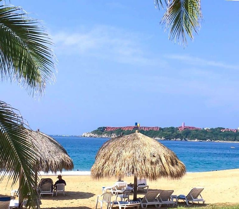 palapa with chair on the beach in Huatulco