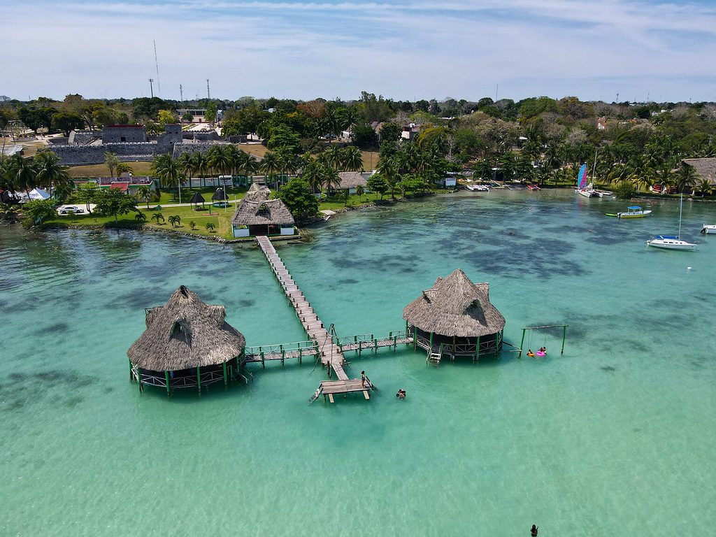 aerial view of a long deck into the Bacalar Lagoon at a Bacalar Hotel 