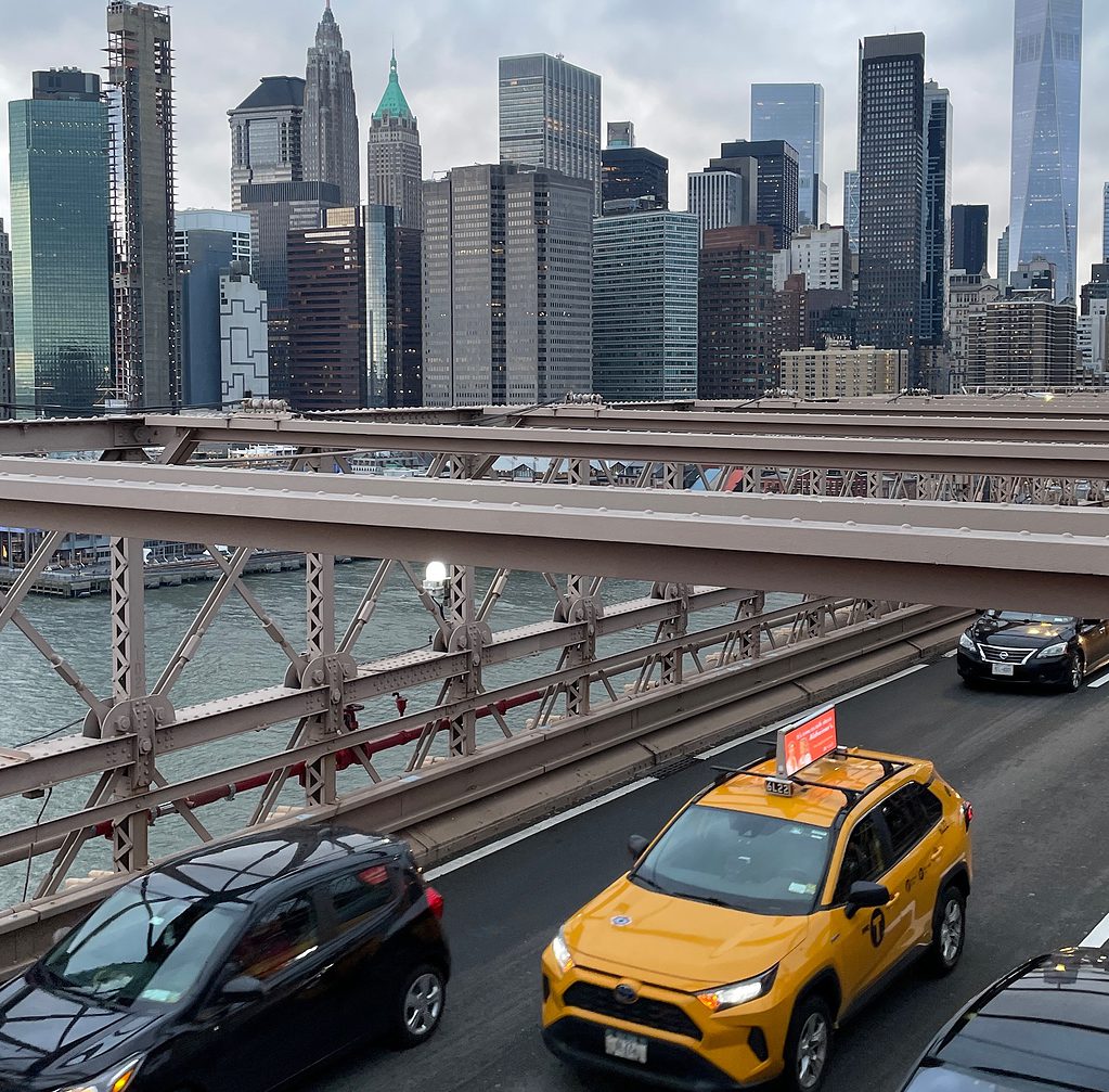 views of the New York City skyline from the Brooklyn Bridge