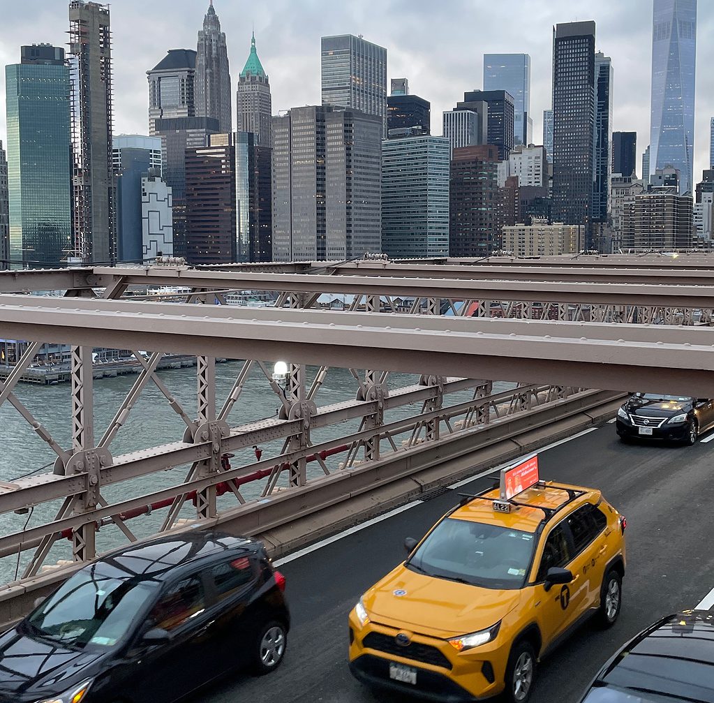 views of the New York City skyline from the Brooklyn Bridge, one of the best free things to do in NYC