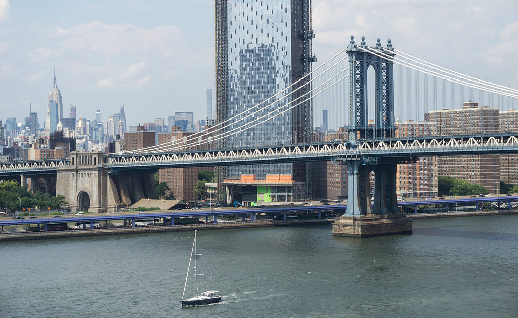 views of the Manhattan bridge and New York City skyline from the Brooklyn Bridge