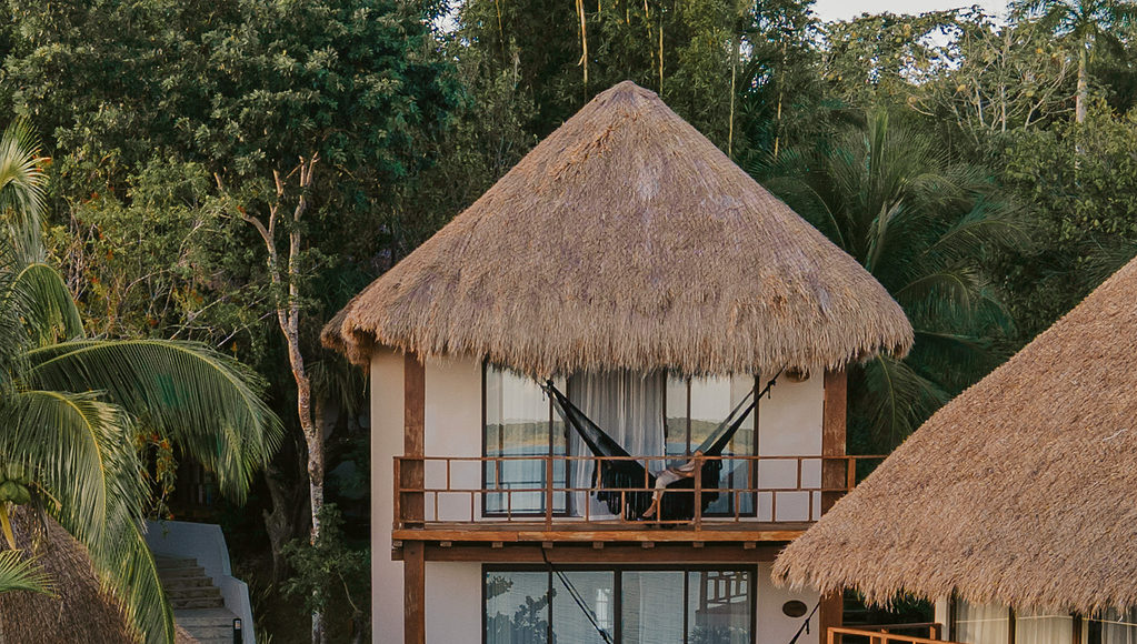 stunning exterior featuring a palapa roof at the Khaban Bacalar Hotel