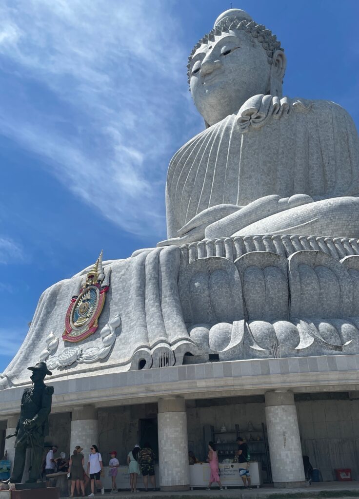 the famous tall white big buddha of phuket on a clear sunny day