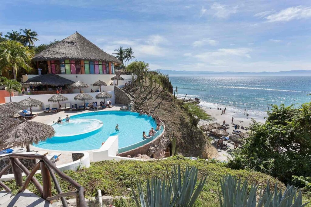 view of the pool and private beach at the Grand Palladium Vallarta resort