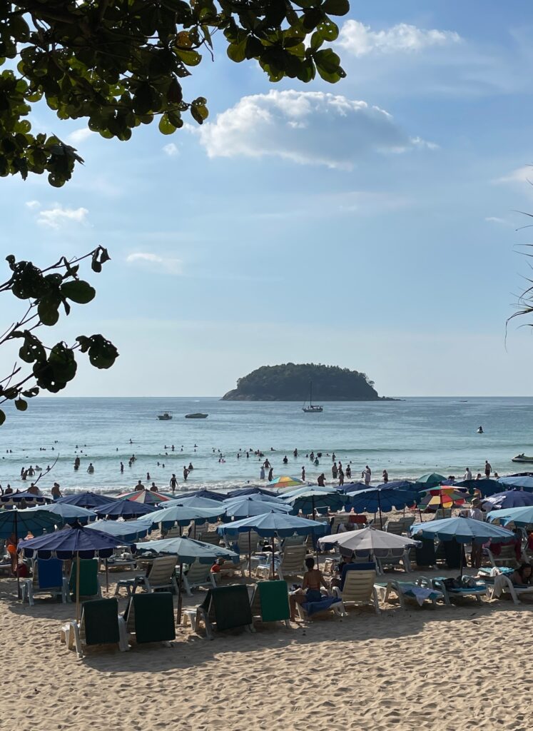 several beach lounge chairs along the Kata Beach in Phuket