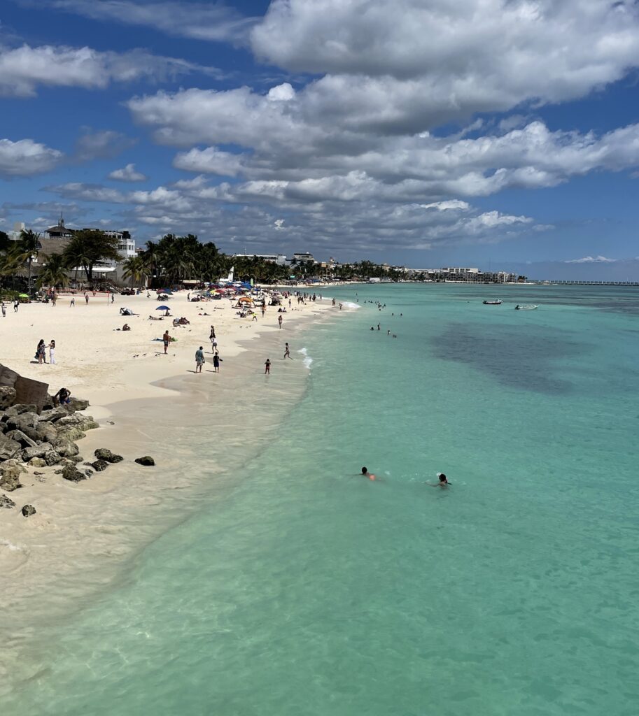 stunning shades of turquoise waters at the main beach in Playa Del Carmen; is Playa Del Carmen expensive to visit