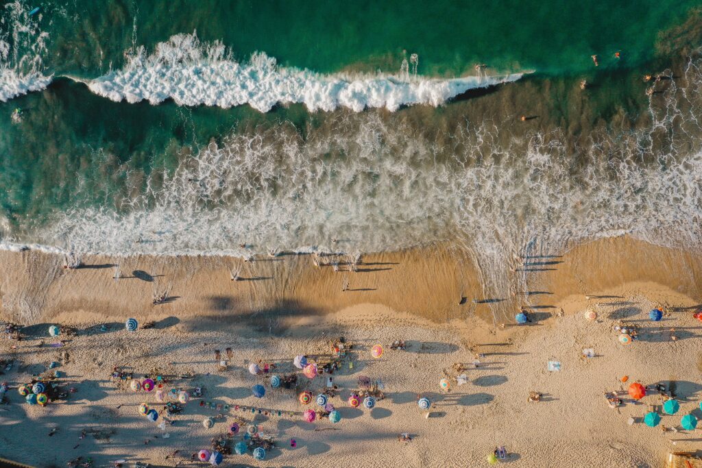 aerial view of several tourists at playa sayulita in mexico