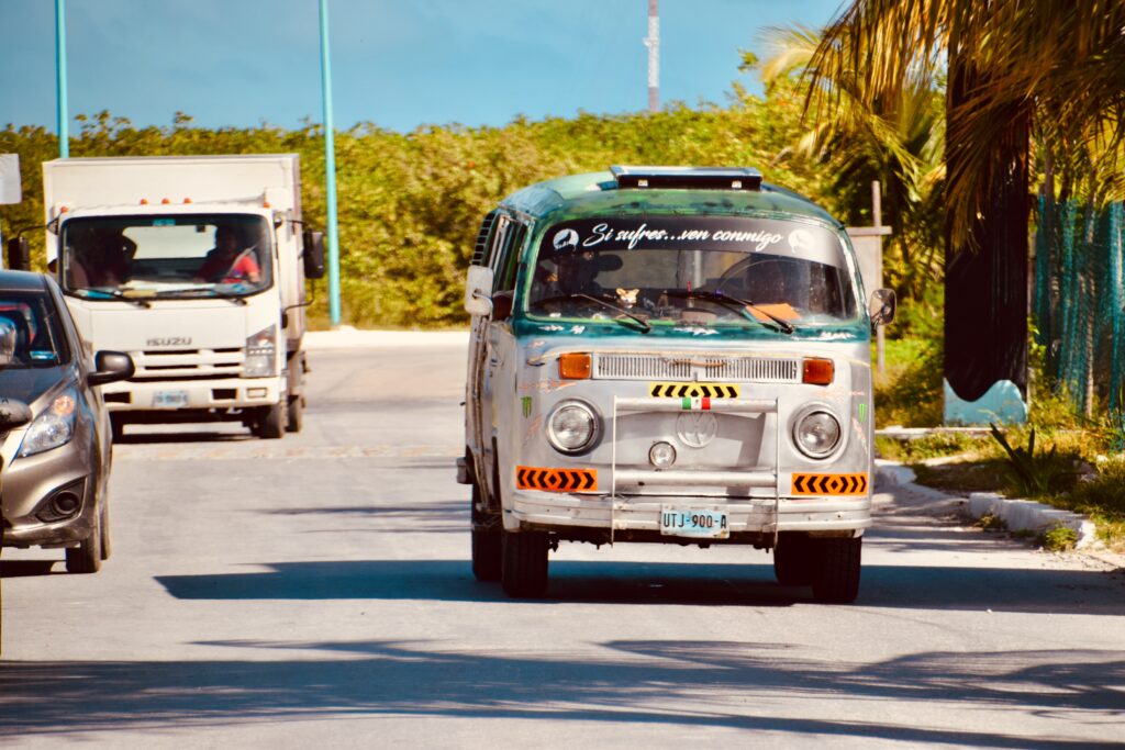 old style Volkswagen van driving on the roads of Mahahual Mexico 