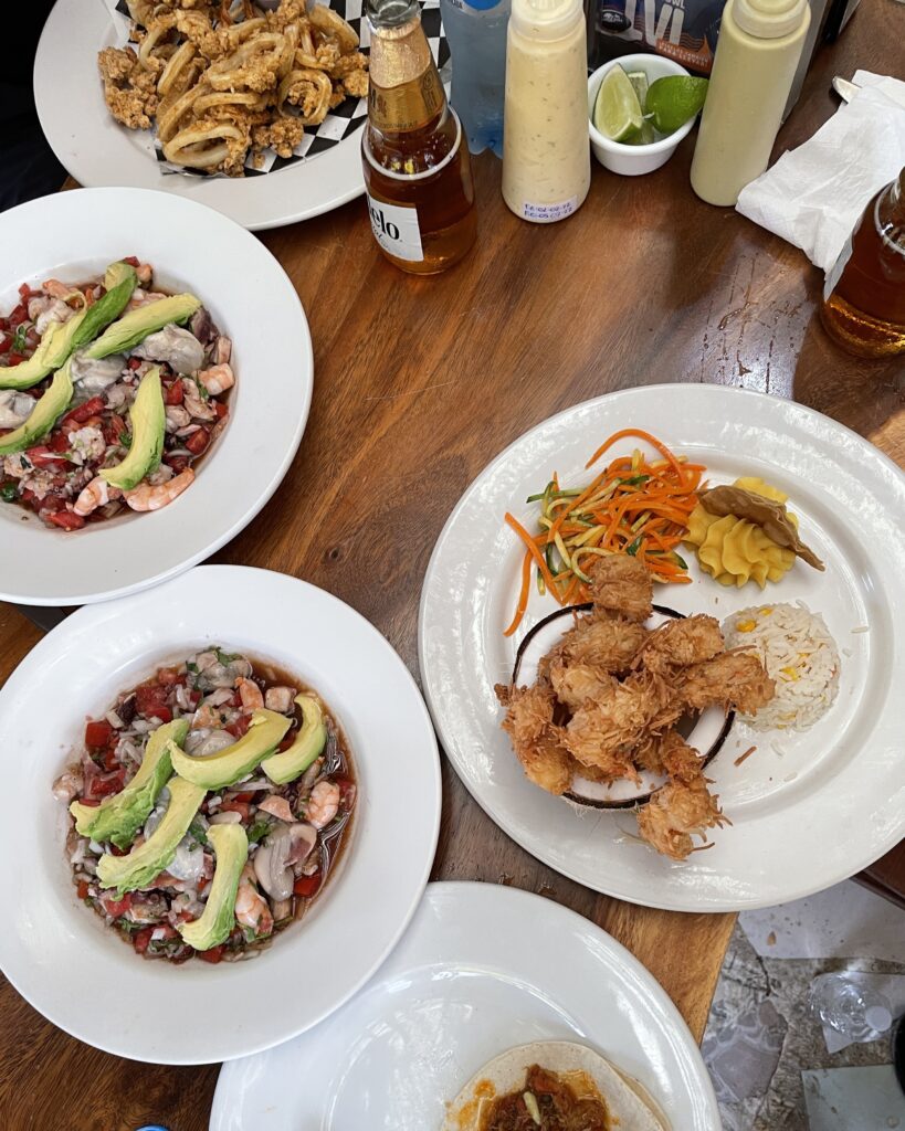 several seafood dishes being served in a Mexican Seafood restaurant in Playa Del Carmen, Mexico 