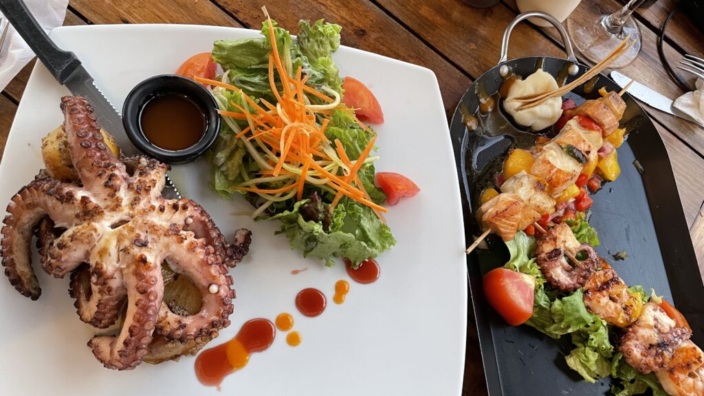 grilled octopus with salad and several seafood skewers at Chiltepin Marisquillos