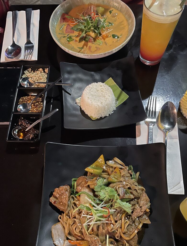 thai food being severed on several plates at Po Thai Restaurants in Playa Del Carmen