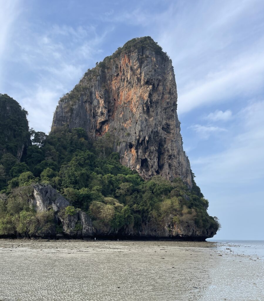 the famous large limestone rock at Railay Beach, Krabi in the morning while the tide is very low