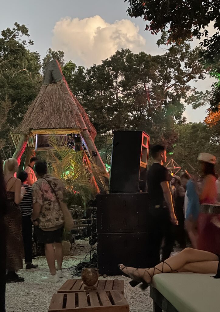 several party goers in the early morning hours in a jungle of Tulum