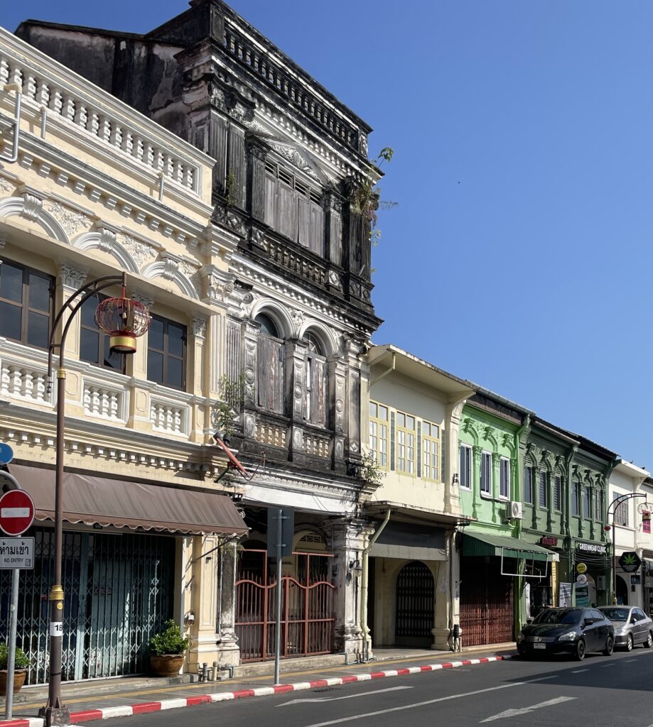 A street full of colorful Portuguese style buildings in Phuket Old Town, Thailand