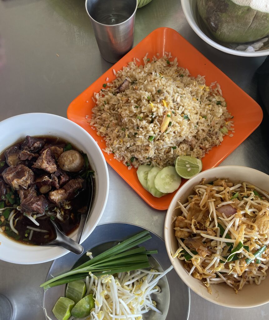 various traditional Thai dishes being served at The Pad Thai Shop restaurant in Kata, Phuket