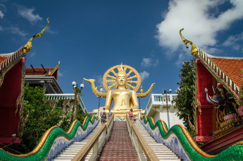 the famous golden Big Buddha in Koh Samui along with the many colourful steps to climb up to it