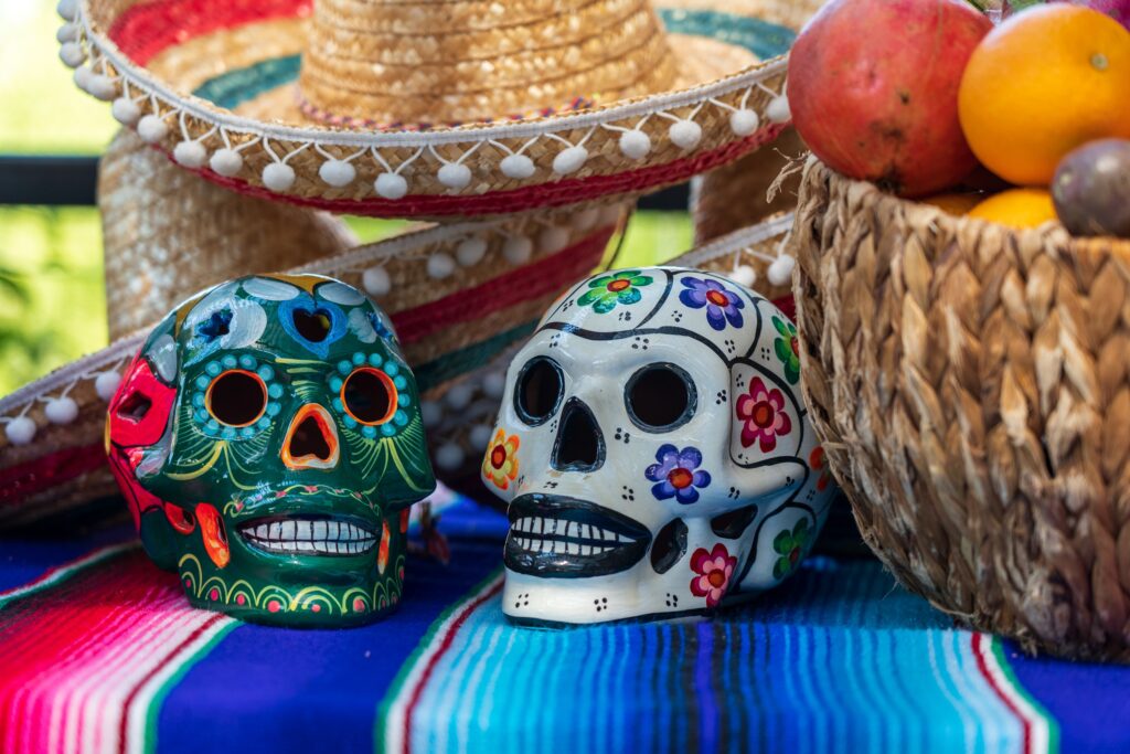 two beautifully decorated colourful skulls on a table to celebrate the Day of the Dead holiday in Mexico