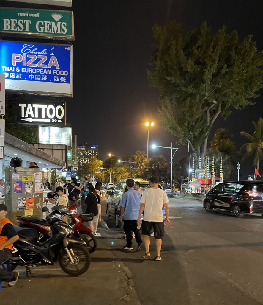 several tourist and locals walking during the night in Pattaya City