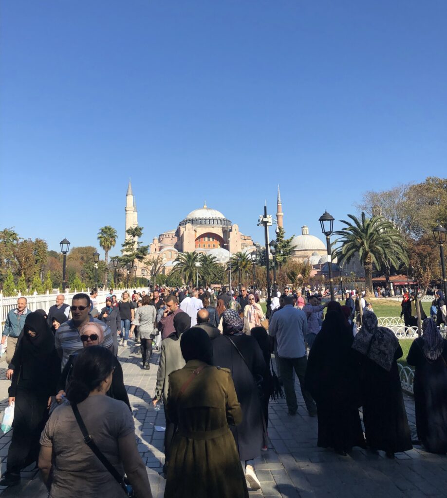 several worshippers walking towards the famous Hagia Sophia Mosque in Istanbul, Turkey