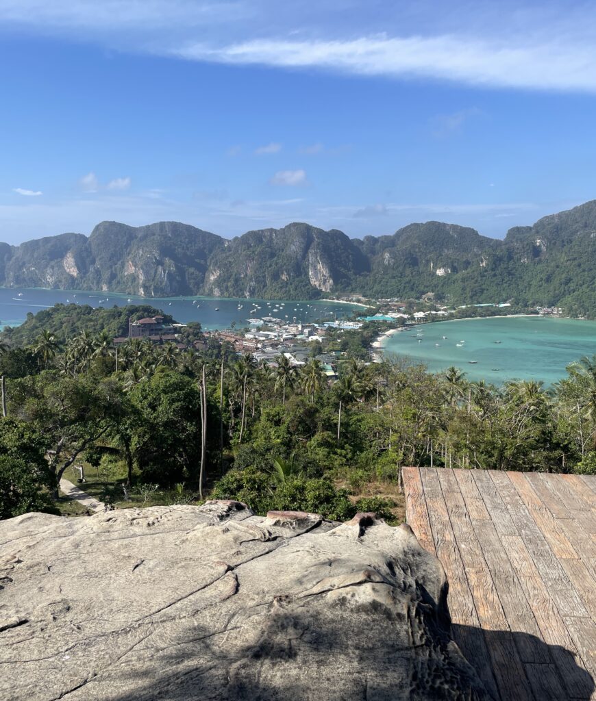 views of the entire Phi Phi Don island showing both bay's connection to the island, clear skies, and green mountains from Koh Phi Phi Viewpoint 2