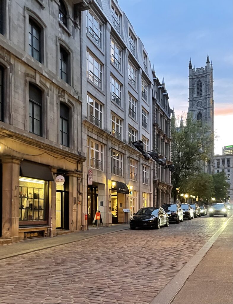 Empty cobblestone streets in Old Montreal at sunset, is Montreal expensive to visit?