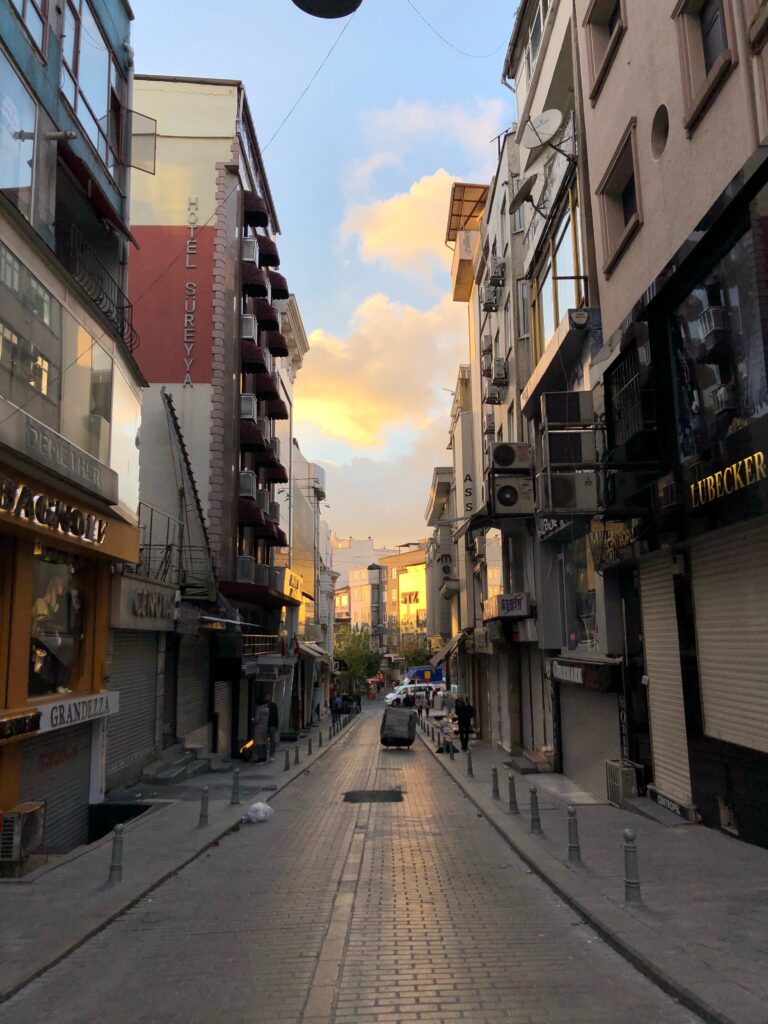 small beautiful cobblestone hilly street at peak sunset in Istanbul , Turkiye
