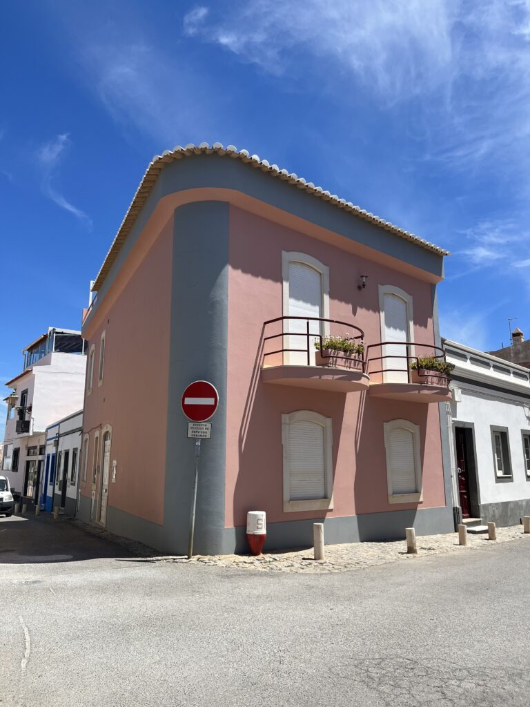 pink pastel building on the streets in Old Town Lagos, Portugal