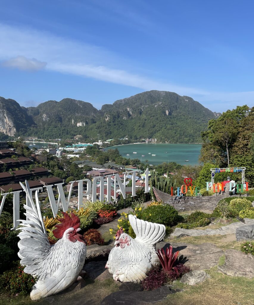 large sculptures of chickens and the Viewpoint 1 sign along with an amazing scenery from Viewpoint 1 at Phi Phi Island