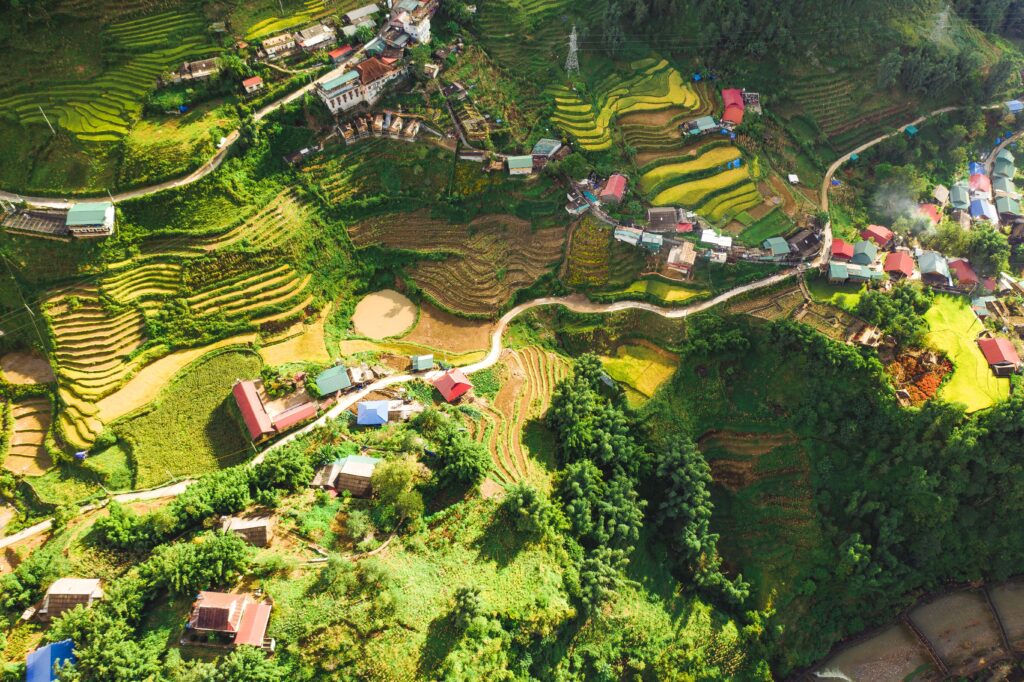 aerial shot of the small village of Sapa, Vietnam, located amongst the forests and rice fields 