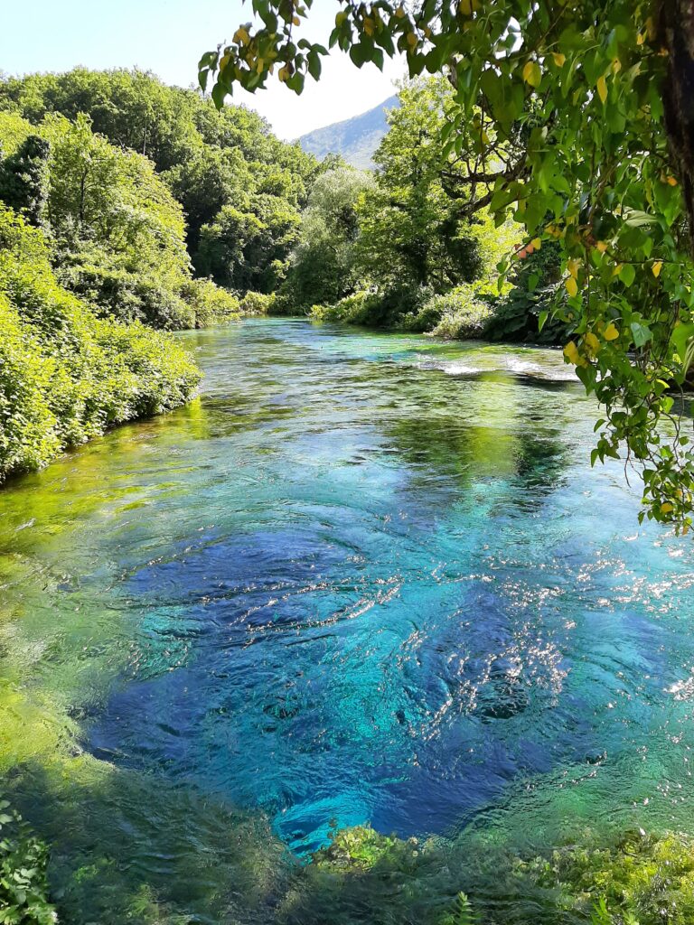 vibrant emerald natural reserve area in Ksamil, Albania named Blue Eye