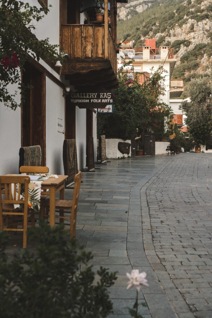 empty chairs at a adorable side street cafe in the town centre of Kas   Turkey