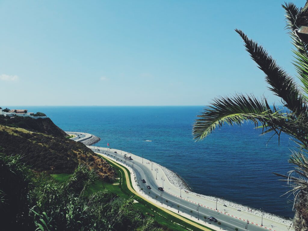 stunning views of a coastal highway along the water in Tangier, Morocco