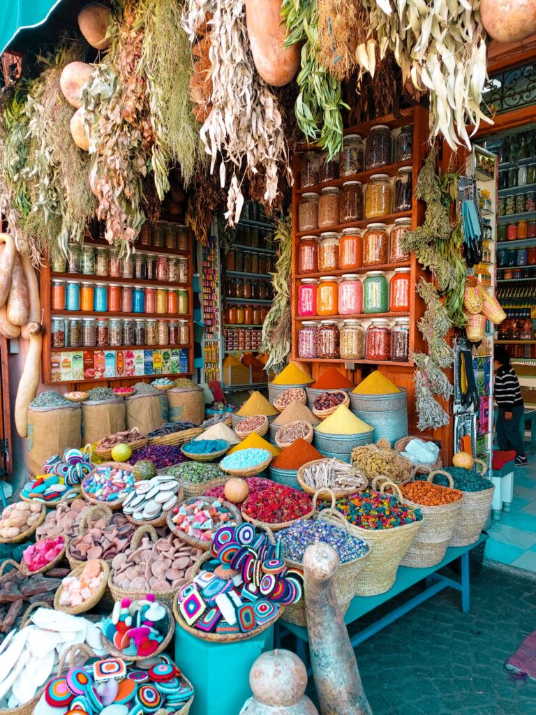 a wide selection of fresh spices displayed at a street shop in Marrakech, Morocco
