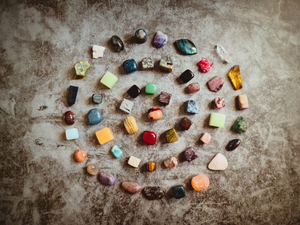 several gemstones spread out on a table, one of the most popular scams in Pattaya City