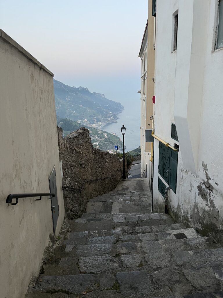 steep downward walkway with mountain and sea views in Ravello, Italy 