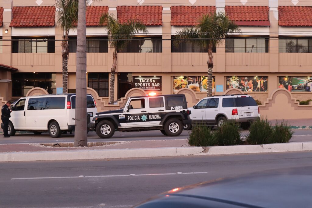 police cars parked on the side of the road in Mexico