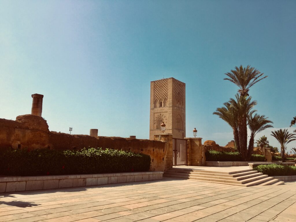 a beautiful mosque among many palm trees in Rabat, Morocco