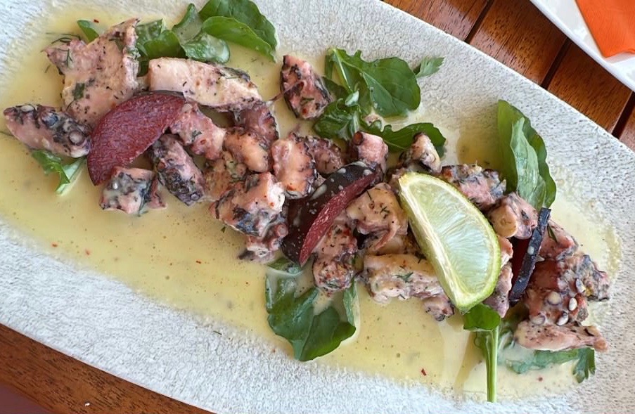 octopus dish being served on the beach in Ksamil 